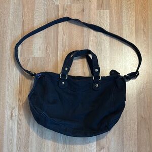 Versatile Black Shoulder Bag with Adjustable Strap